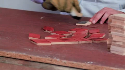 Workman in the process of applying mordants to the wood Video stock 69205197