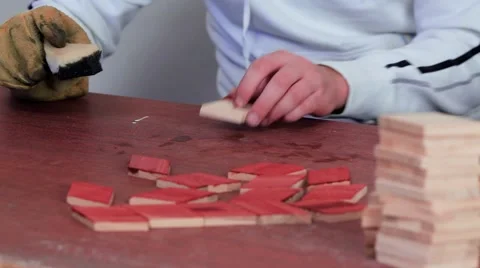 Workman in the process of applying mordants to the wood Stock Footage 69205216