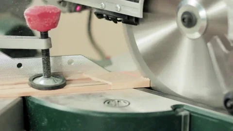 Workman sawing wood using a miter saw Stock Footage 69205378