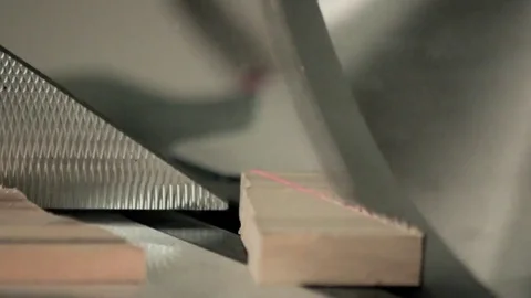 Workman sawing wood using a miter saw Stock Footage 69205392