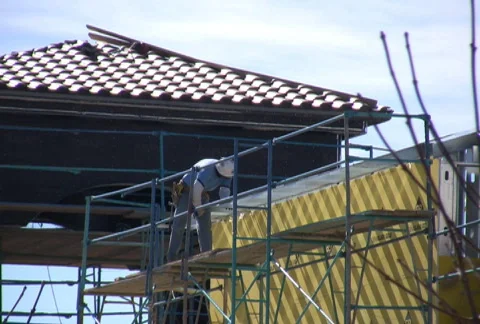 Workman on Scaffolding Stock Footage 74707