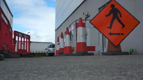 Workman sets up site for roadworks Stock Footage 42140384