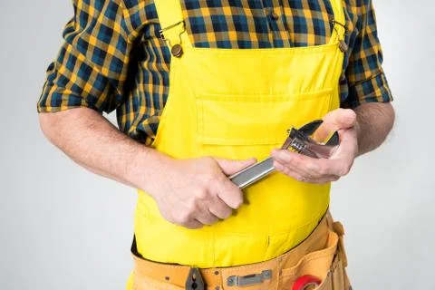 Workman with tool belt Stock Photos