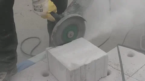 Workman trimming a stone block Stock Footage