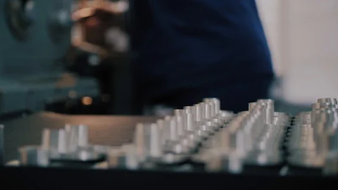 Workman in uniform working on lathe machine, close up. Concept of industry Stock Footage 104877544
