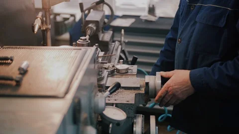 Workman in uniform working on lathe machine, close up. Concept of industry Video stock 104877623