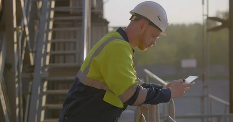 Workman using mobile phone Stock Footage 114334800