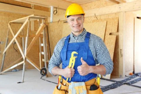 Workman with wrench Stock Photos