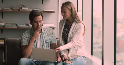 Workmates working together on common task discuss project using laptop Video stock 153813425