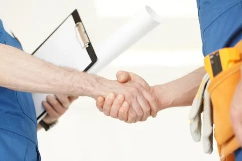 Workmen handshake Stock Photos