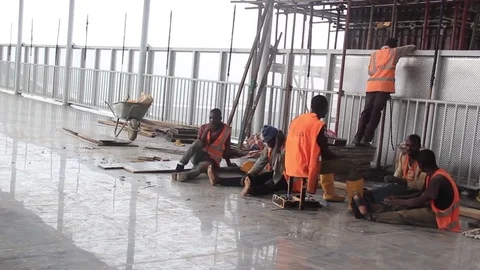 Workmen in safety jackets take a break Stock Footage 75893573