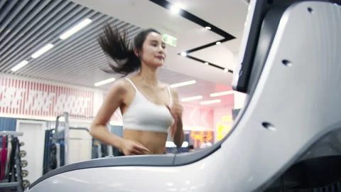 Workout Girl Running on Treadmill Video stock 238684014