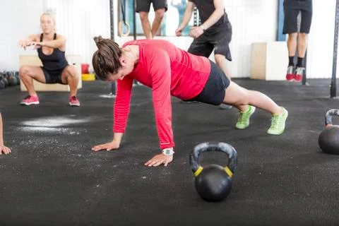 Workout group trains different exercises Stock Photos