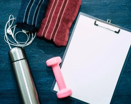 Workout objects with blank notepad for sport concept Stock Photos