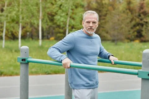 Workout On Parallel Bars Outdoors Stock Photos