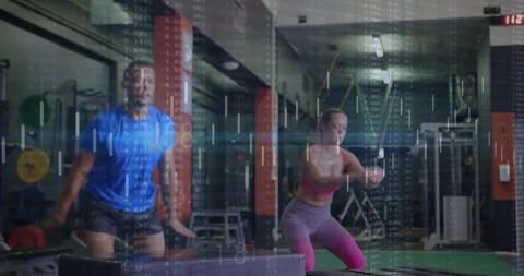Workout partners starting by jumping onto plyo boxes driving knees jumping and Stock Footage 311508327