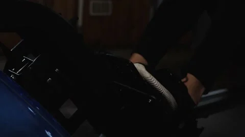 Workout on rowing machine Stockbeeldmateriaal 160040658