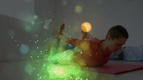 At workout start duo doing Superman hold on yoga mats during fitness class for Stock Footage 313570875