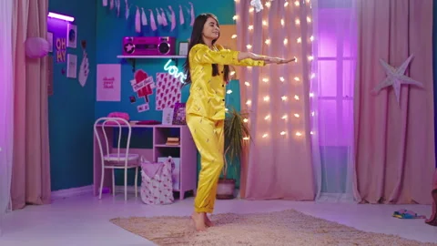 Workout time for a good looking lady doing sport at home in her bedroom in the Stock Footage 136098550