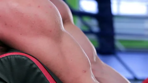 Workout for young bodybuilder. Lifting barbells for biceps to bench Scott Stock Footage 58053100
