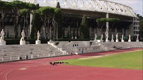 Workouts at the Rome olympic stadium Stock Footage 102510012