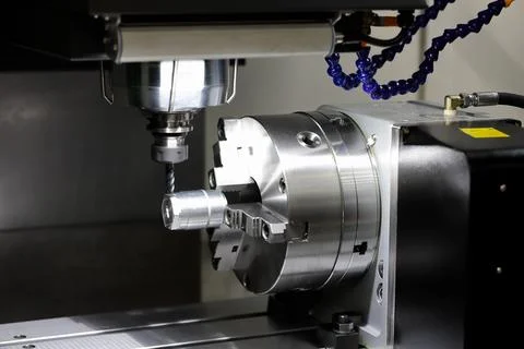 Workpiece milling with 4 axis CNC machining center Stock Photos