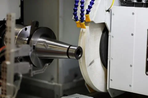 Workpiece processing with an abrasive wheel Stock Photos