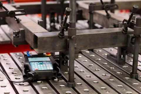 Workpieces and CNC welding robot controller Stock Photos