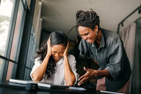 Workplace aggression, stressful work environment. Angry boss shouting at th.. Stock Photos
