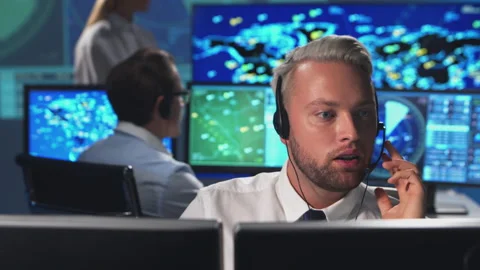 Workplace of the air traffic controllers in the control tower. Diverse team of Stock Footage 145488332