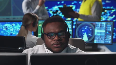 Workplace of the air traffic controllers in the control tower. Diverse team of Stock Footage 145719523