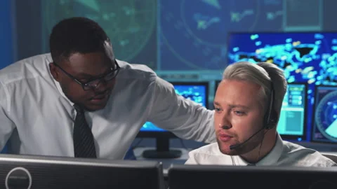 Workplace of the air traffic controllers in the control tower. Diverse team of Stock Footage 145776513
