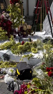 Workplace and process of creating a wedding flower arch with fabric and white Stock Photos