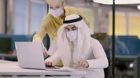 Workplace of an arab businessman during a pandemic. A man in Arabic clothes and Stock Footage 134792753