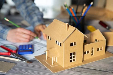 Workplace of architect - construction drawings, scale model and tools. Modern Stock Photos