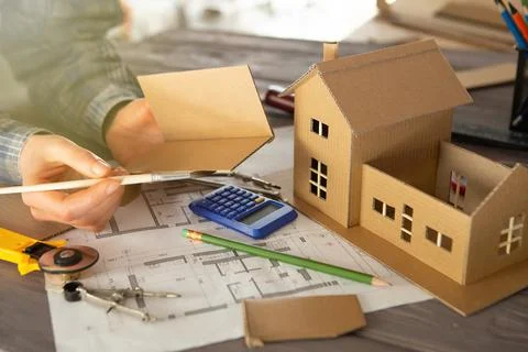 Workplace of architect - construction drawings, scale model and tools. Modern Stock Photos