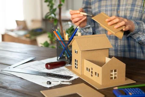 Workplace of architect - construction drawings, scale model and tools. Modern Stock Photos