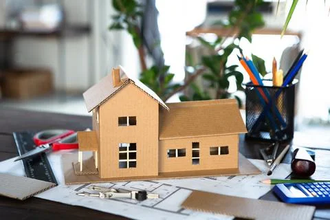 Workplace of architect - construction drawings, scale model and tools. Modern Foto stock