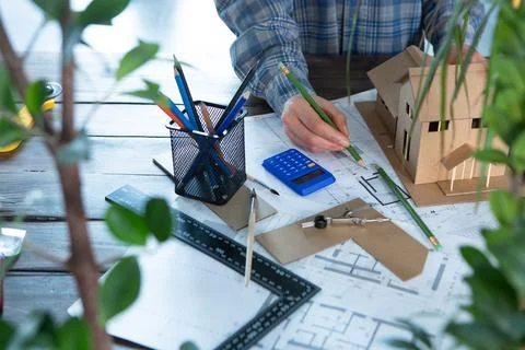 Workplace of architect - construction drawings, scale model and tools. Modern Stock Photos