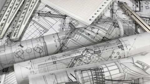 Workplace of the architect: rolls of architectural drawings, compasses, pen Stock Footage 94601669