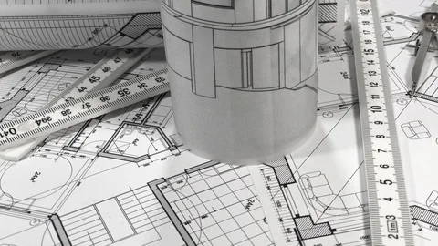 Workplace of the architect: rolls of architectural drawings - blueprints Stock Footage 94603310