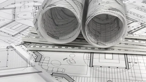 Workplace of the architect: rolls of architectural drawings - blueprints Stock Footage 95047517