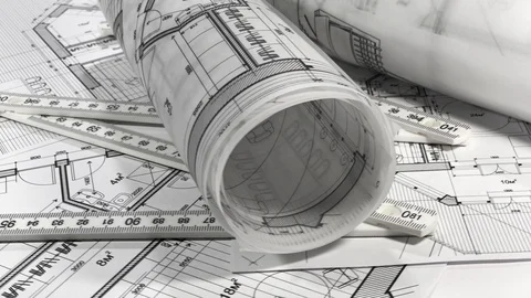 Workplace of the architect: rolls of architectural drawings - blueprints, yardst Stock Footage 95085306