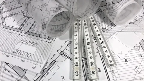 Workplace of the architect: rolls of architectural drawings - blueprints Stock Footage 95677360