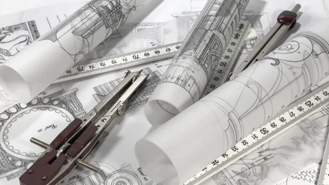 Workplace of the architect: rolls of blueprints, compasses Stock Footage 94529744