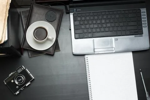 Workplace for art with notebook, laptop, camera and coffee Stock Photos
