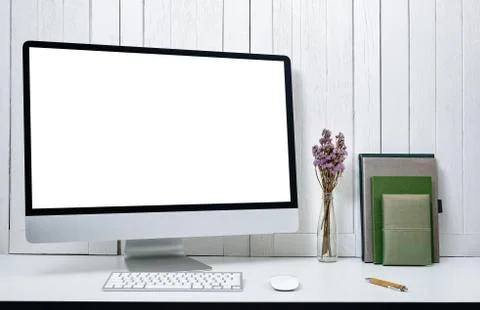 Workplace background with Blank white screen modern desktop computer. White w Stock Photos