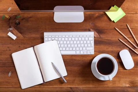 Workplace background, top above view of desk with desktop computer monitor ke Stock Photos