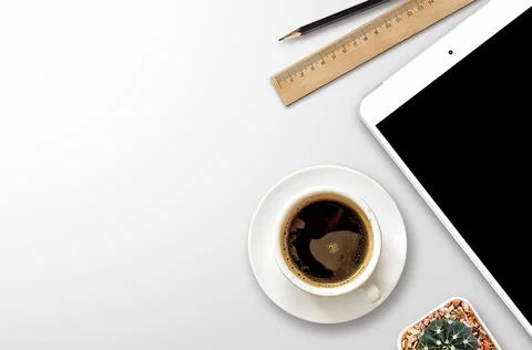 Workplace with blank screen smartphone, tablet, coffee cup, paper and noteb.. Stock Photos