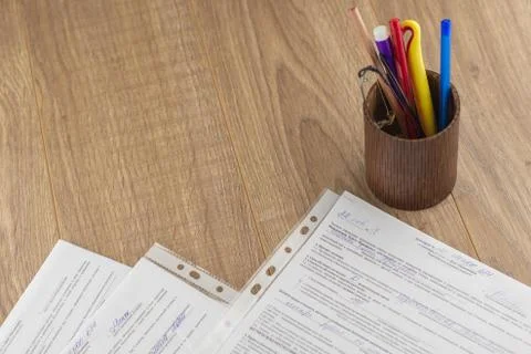 Workplace of the businessman: some forms of contracts, filled and empty, and Stock Photos